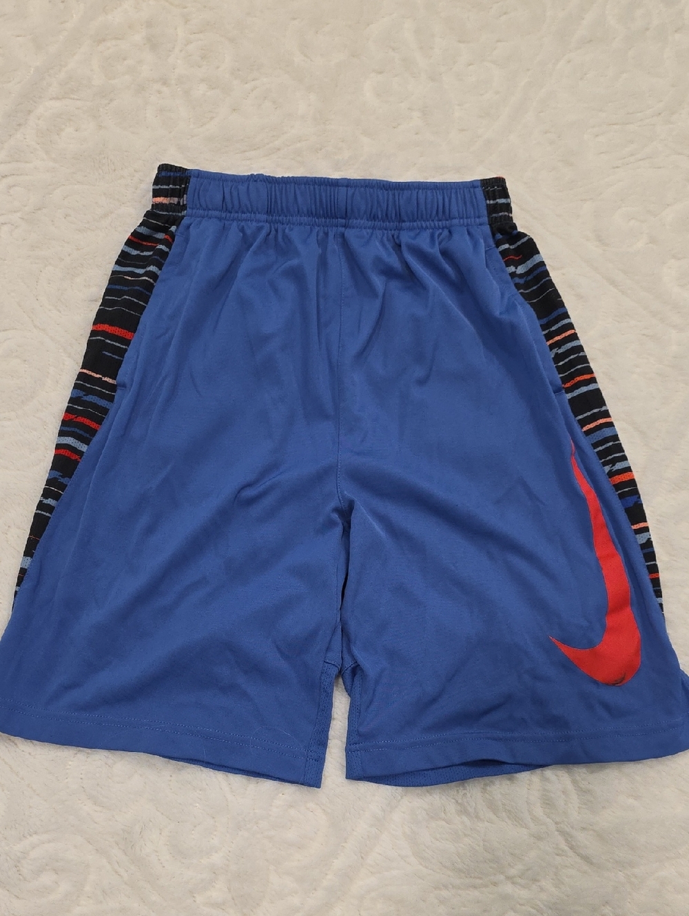 Nike Blue Kids Athletic Shorts with Red Swoosh